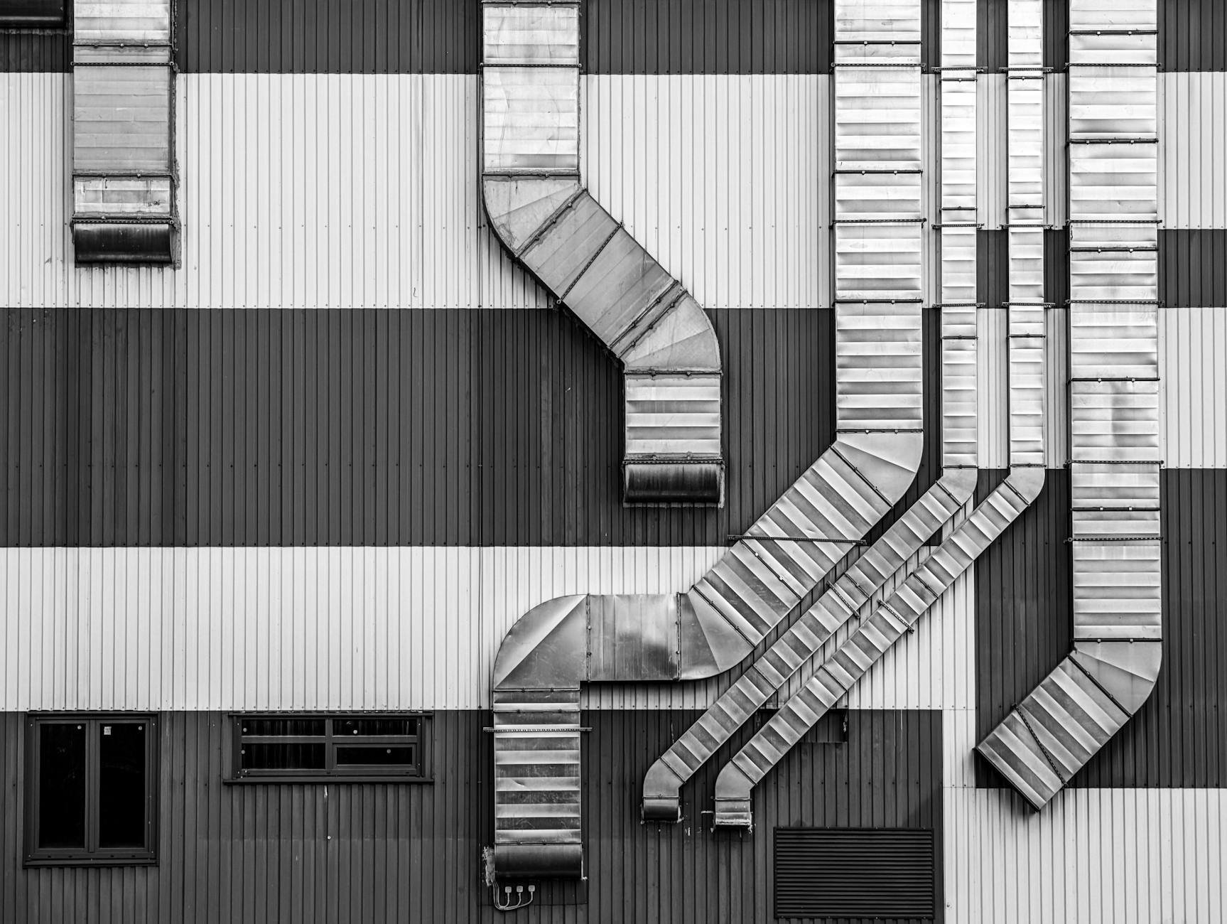 abstract industrial ductwork on building exterior