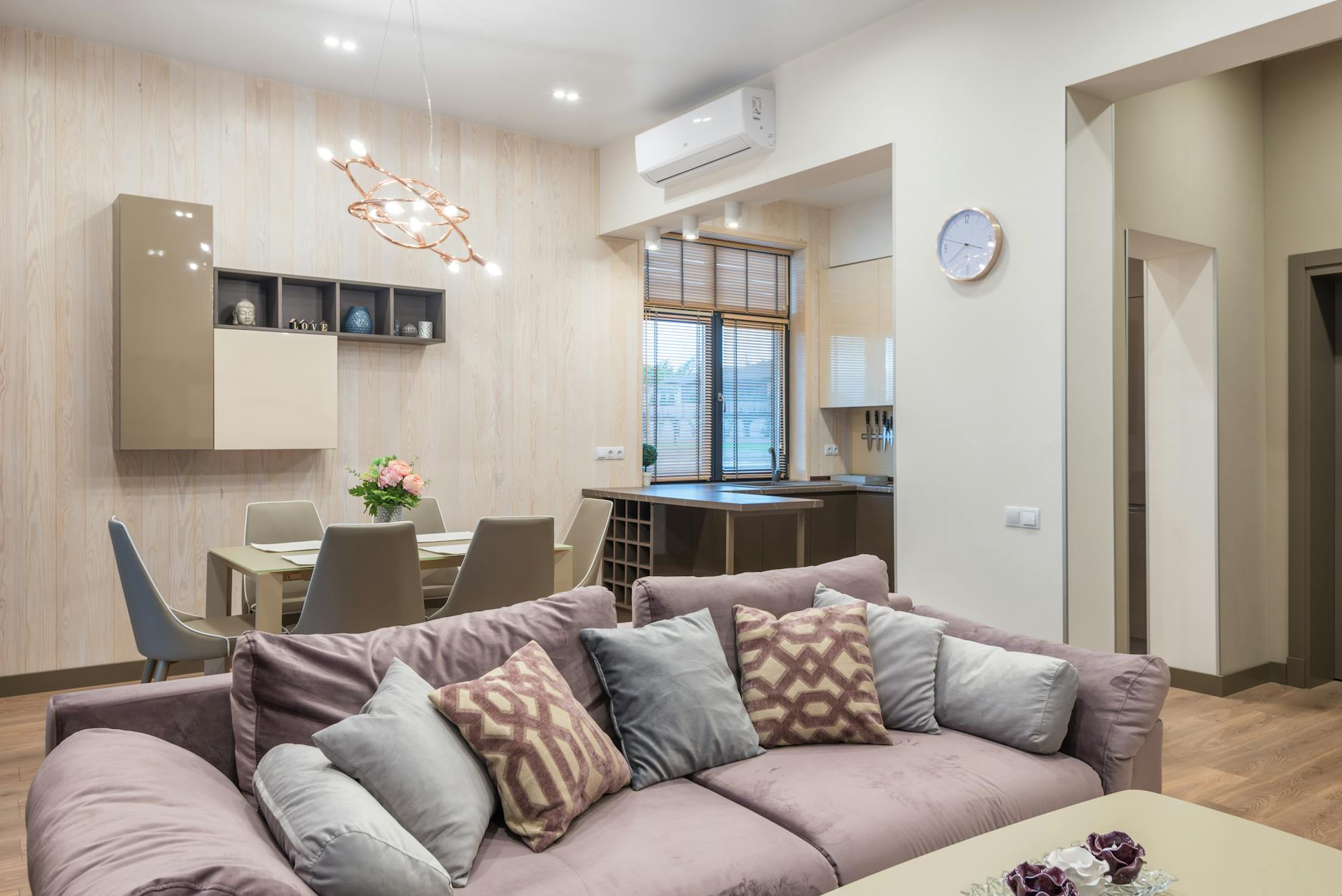 spacious living room with cozy sofa and dining area